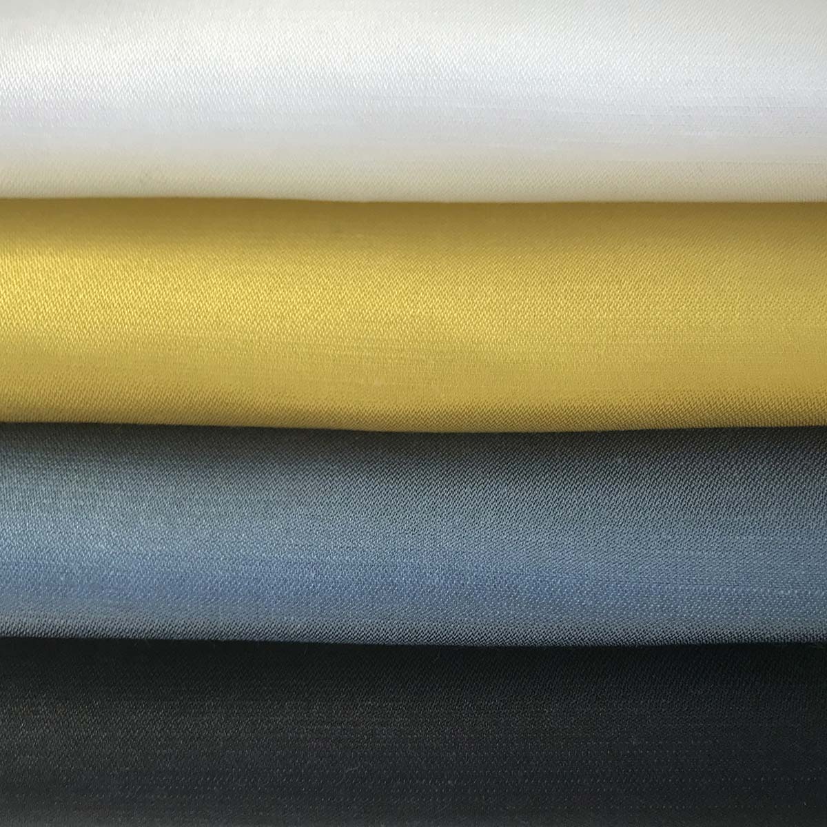 Samples of satin from organic cotton, silk and hemp